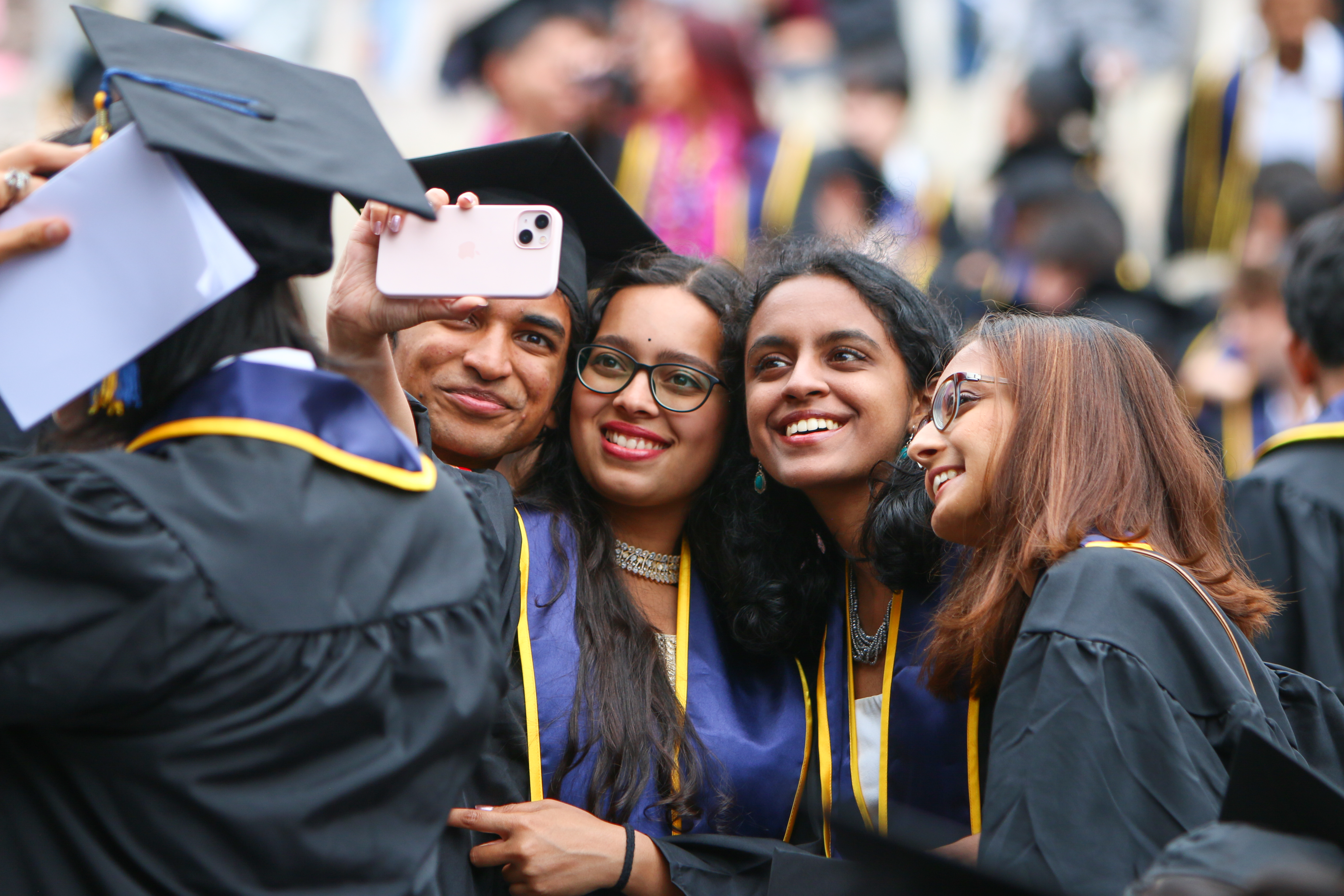 Students take a selfie at one of UC Berkeley's inaugural College of Computing, Data Science, and Society commencement ceremonies. (Photo/ Kayla Sim, UC Berkeley College of Computing, Data Science, and Society)