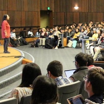 Professor Ani Adhikari lectures to audience of students in Data 8