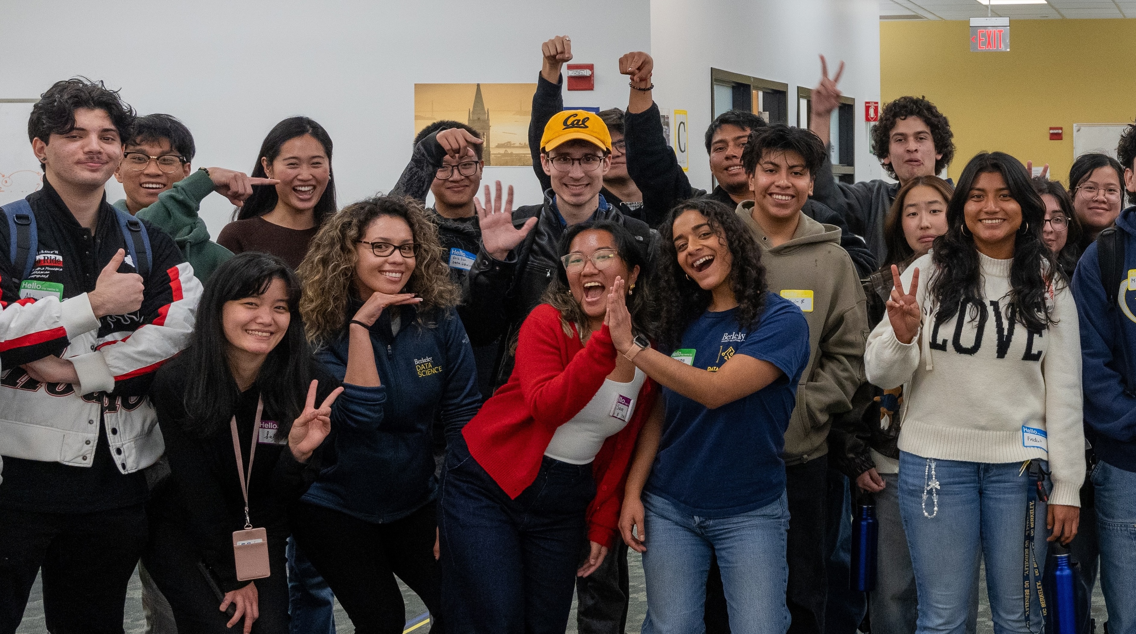 Data Scholars high five and pose for a group photo at the Fall 2024 Scholars First event