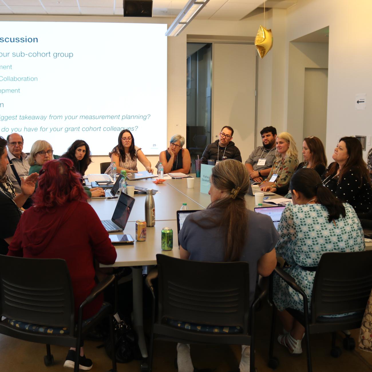 Educators collaborating at a table at the National Workshop for Data Science Education