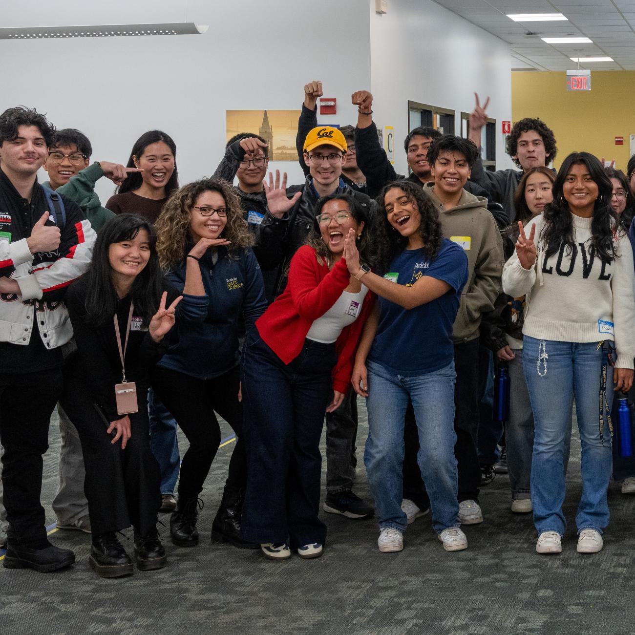 Spring 2025 Data Scholars pose with cheers at Scholars First welcome event