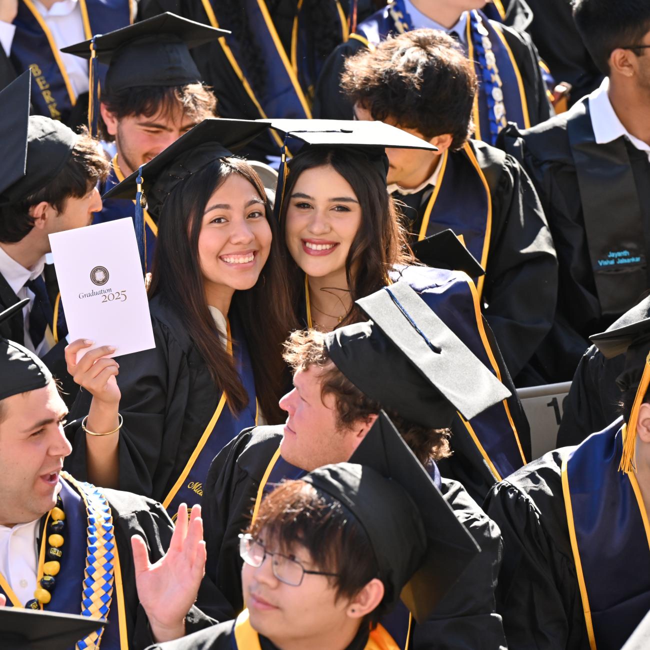 Graduate holds program during CDSS Commencement 