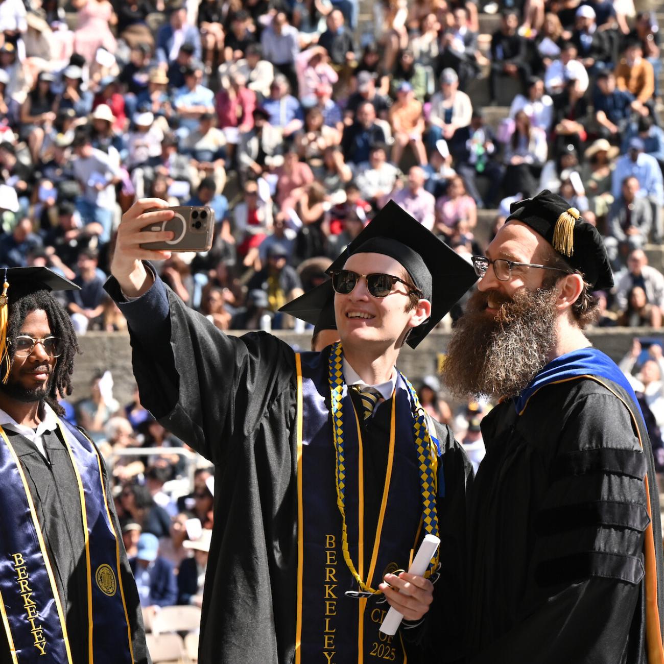 Andy Konwinski takes a selfie with graduate at the 2025 CDSS Commencement