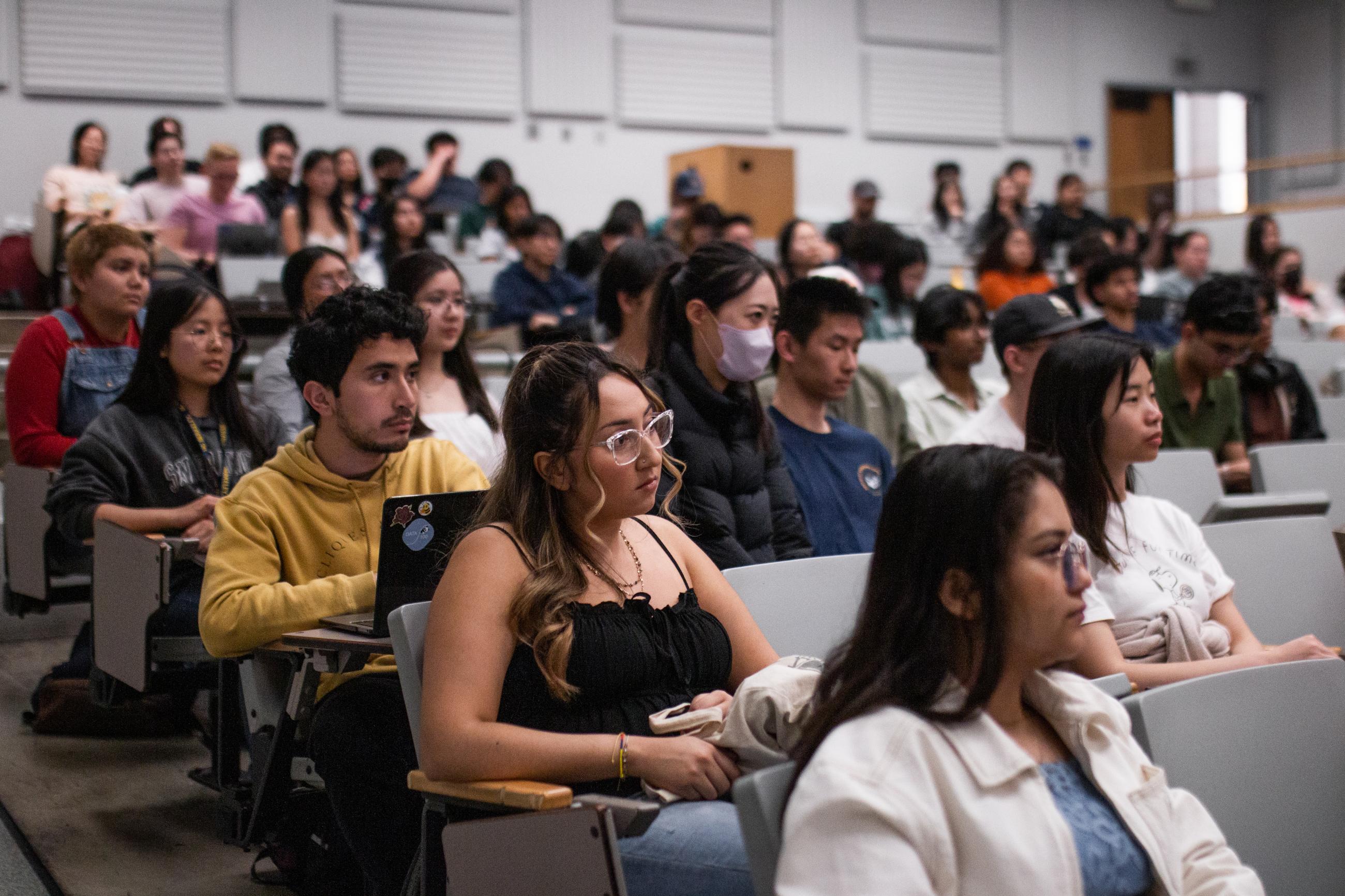 An audience of Data Scholars students listening to the event's speakers.