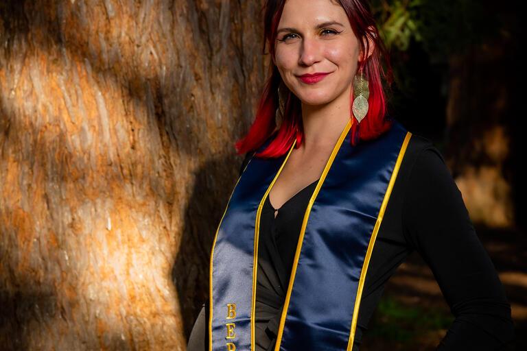 Photo of Eva Smolentseva posing in Berkeley stole in front of redwood