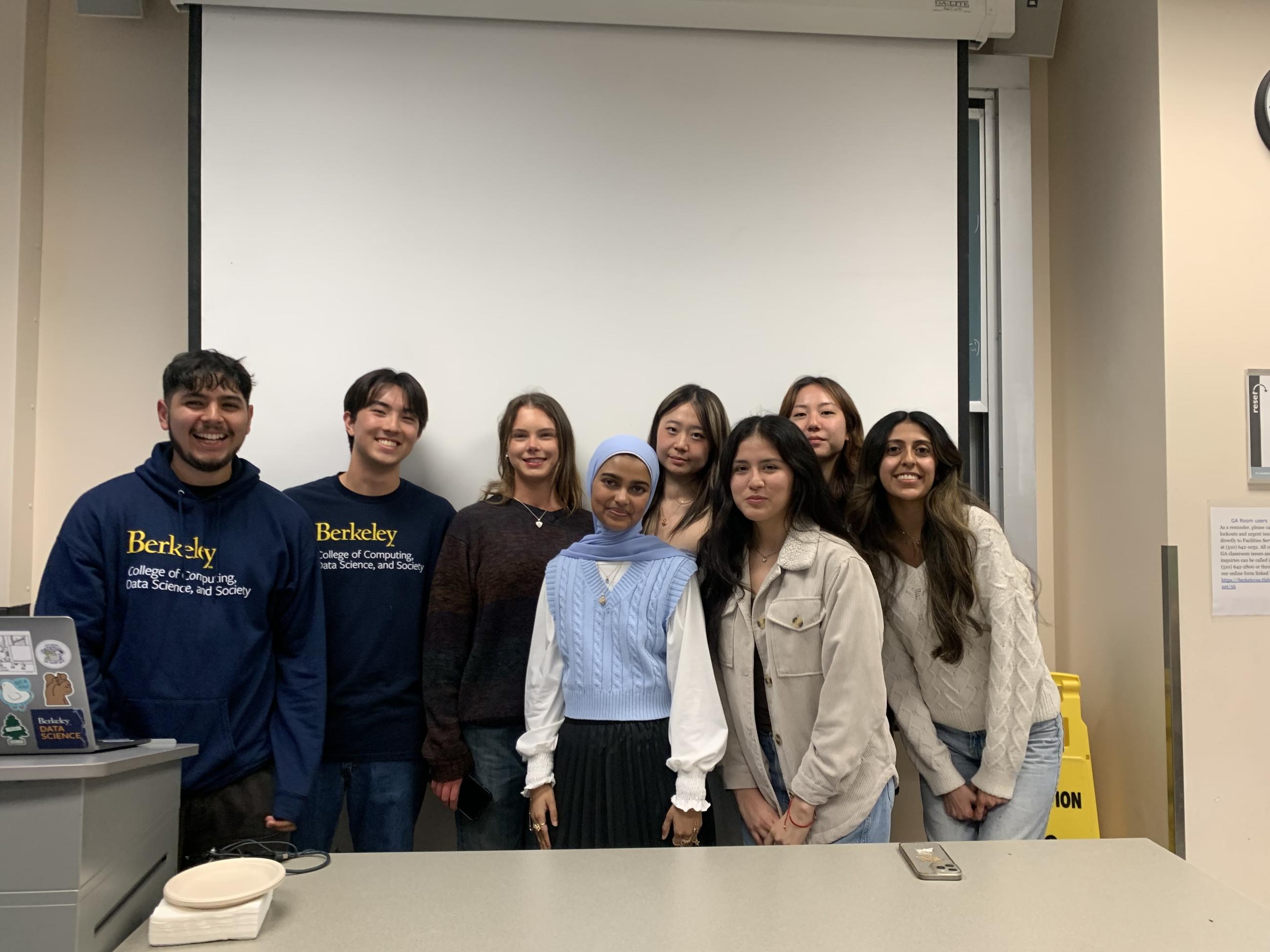 Group picture of 8 Data Science Peer Advisors in a VLSB classroom.