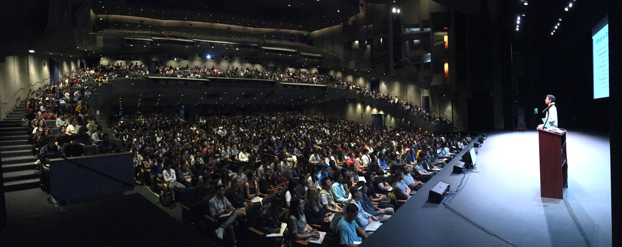 Data 8 lecture Fall 2019 with shot of instructor on stage with large student audience