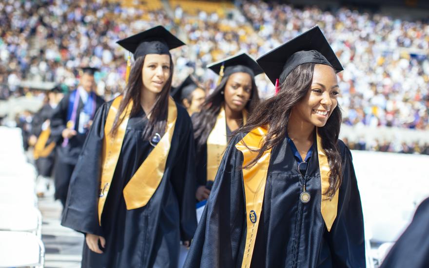 Graduates walk at UC Berkeley commencement in 2014. (Photo/ Elena Zhukova)