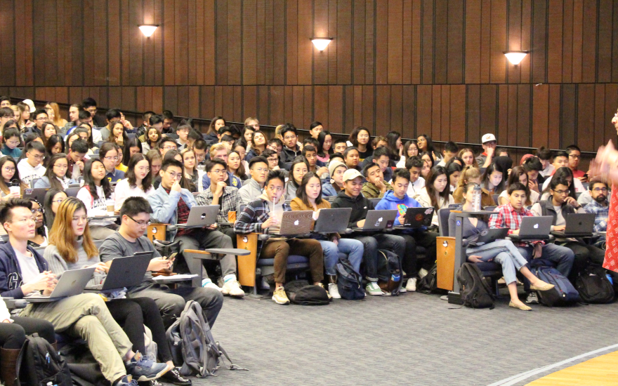 Lecturer speaking in front of classroom of data science students