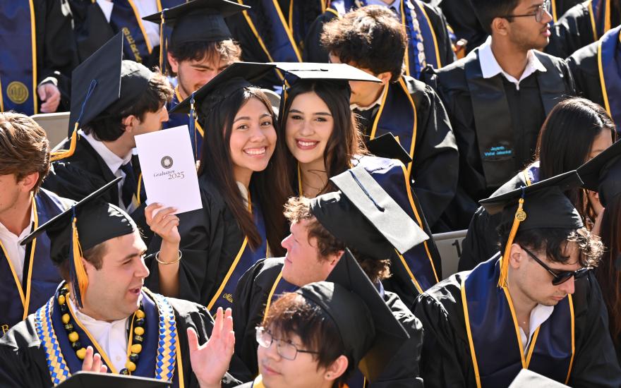 Graduate holds program during CDSS Commencement 